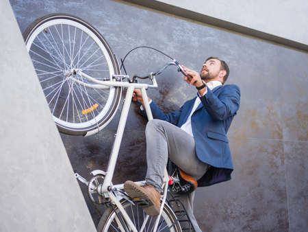The businessman lifted his bike up and reassembled