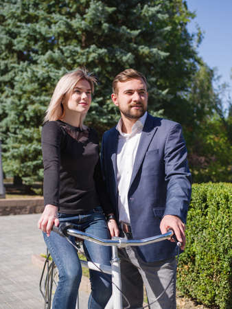 A guy is riding his girl on a bikeの写真素材
