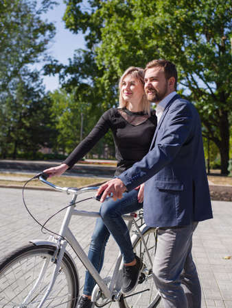 A guy is riding his girl on a bikeの写真素材