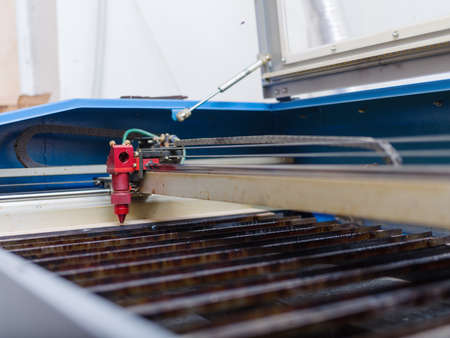 Automated machine for burning out patterns on a treeの写真素材