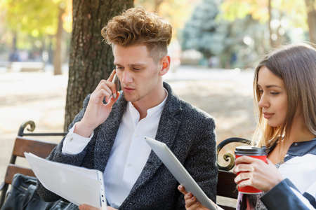 Business partners sit on a bench. Business concept.の写真素材