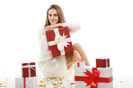 Young girl with gifts isolated on white background.