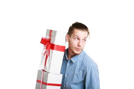A young man in a blue shirt with presents. Close-up.の写真素材
