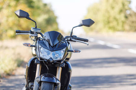 A motorcycle close-up stands on the road aloneの写真素材