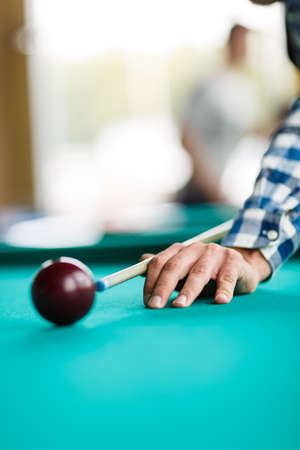 The player is going to break the pyramid with a red ball