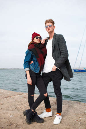 Cheerful young couple having fun and laughing together outdoors.