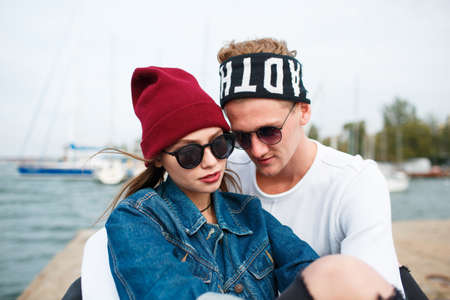 Happy young couple having fun and laughing together outdoorsの写真素材