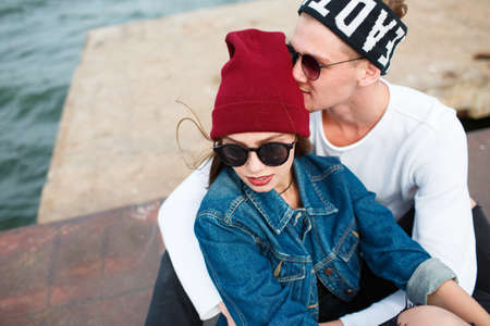 Happy young couple having fun and laughing together outdoorsの写真素材