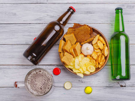 Concept of alcoholism, a set of bottles. Bottles on the background of a gray tree.