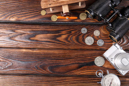 A set of a photographer on a background of brown wood backgrounds background, a banicol, a trifle, a wooden planeの写真素材