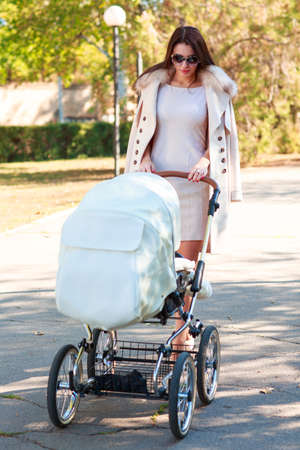 A nice girl is walking with a child on the street.