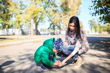 European family mom with her son on the street.の写真素材