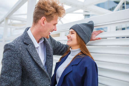 Happy young couple having fun and laughing together outdoors.の写真素材