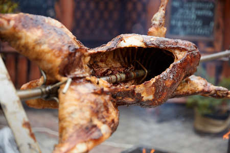 Rabbit juicy cut on a spit on a grill roasted close-upの写真素材