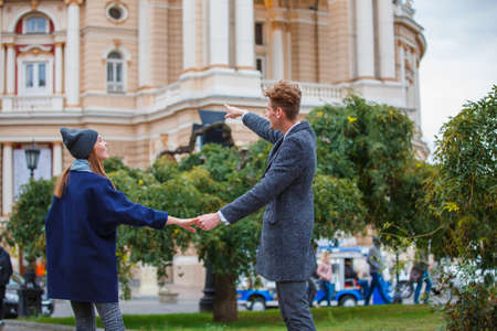 Lovely young couple tours in an unfamiliar cityの写真素材