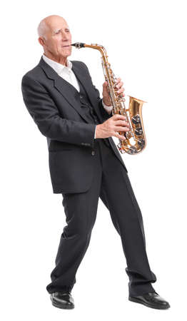 Grandpa playing on trumpet on white isolated backgroundの写真素材