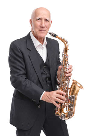 Grandpa playing on trumpet on white isolated backgroundの写真素材