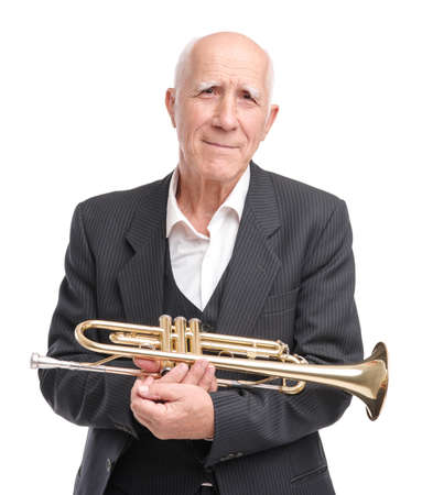 Grandpa playing on trumpet on white isolated backgroundの写真素材