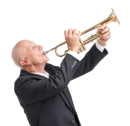 Grandpa playing on trumpet on white isolated backgroundの写真素材