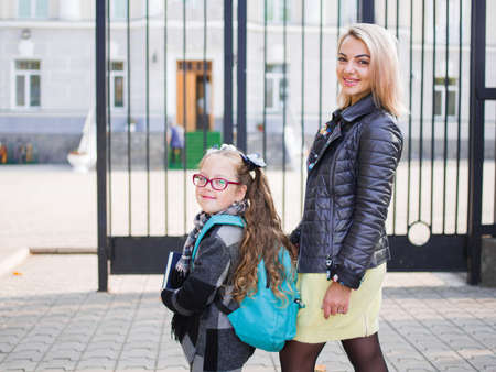 Mother brought her daughter to school, view from behind, Concept familyの写真素材