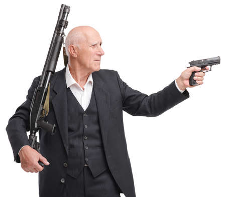 Portrait of grandfather in a suit holds a shotgun on his shoulder, in the other hand gun, isolated...