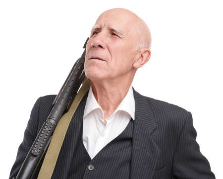 Old man in a suit holds a shoulder shotgun on his shoulder, proudly looks to the side, isolated on a white backgroundの写真素材