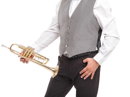 Man in gray waistcoat standing with pipe on his leg isolated on white backgroundの写真素材