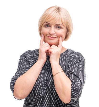 Adult woman, blonde, isolated on white background, fingers make a smile.の写真素材