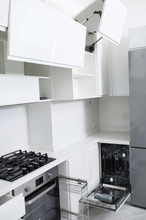 Design of a new light kitchen in pastel colors. There is a dishwasher in the kitchenの写真素材