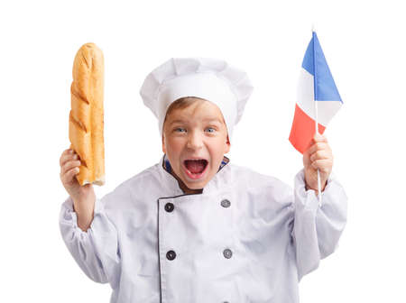 Little chef with baguette and French flag in hand on white isolated backgroundの写真素材