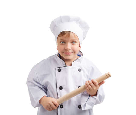 Little chef with a rocking chair in hands on a white isolated backgroundの写真素材