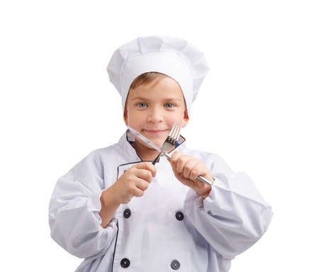 Little cook crossed a fork and knife on a white isolated backgroundの写真素材