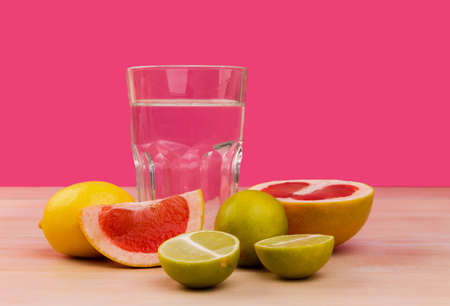 Fruits for a healthy diet on a pink backgroundの写真素材