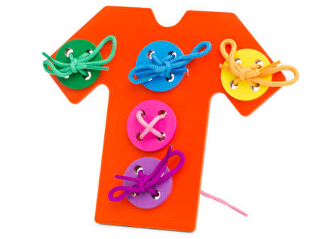Red wooden toys t-shirt jersey with sewn colorful buttons on a white isolated background