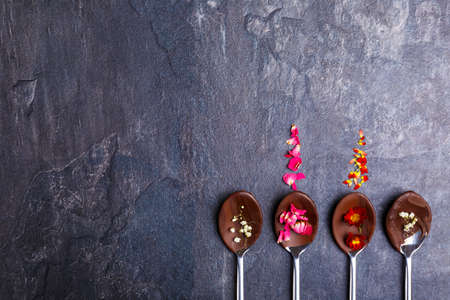 Spoons with frozen chocolate on themの写真素材