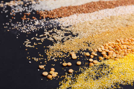 Set of cereals in the form of strips on a black backgroundの写真素材