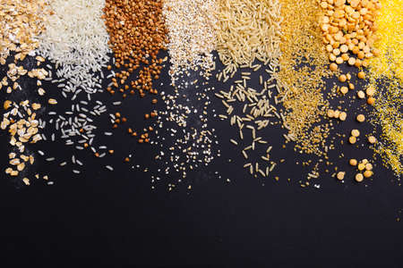 Placer of cereals in the form of strips on a black backgroundの写真素材