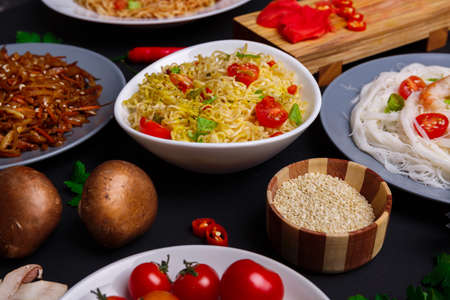 On the table are traditional Chinese dishes of noodles.の写真素材