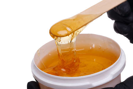 honey in a jar on a white isolated background