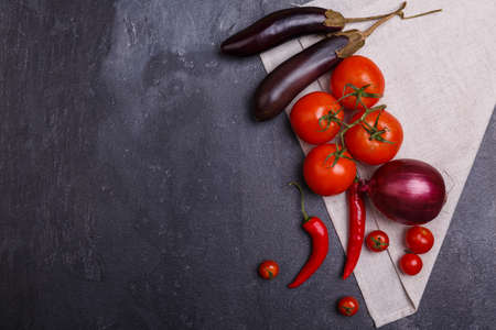 Vegetable composition on a towel on a stone background