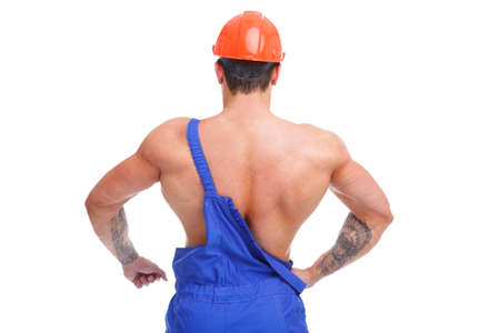 A man is standing with his back on one shoulder strap on a white isolated backgroundの写真素材