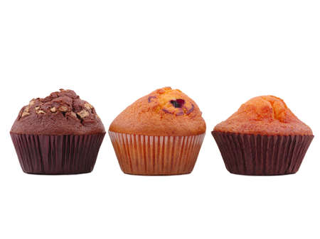 Three different cupcakes, in the middle with jam in paper forms for a cupcake. Front view on white isolated backgroundの写真素材