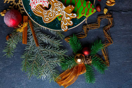 On a surface, Christmas decorations of twigs of trees, snowflakes and cinnamon sticks.の写真素材