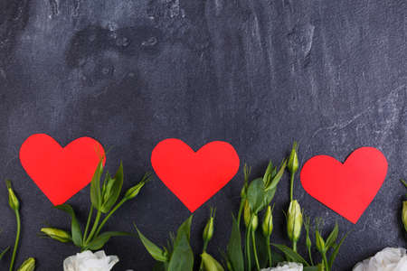 Tip of roses with hearts on a stone backgroundの写真素材