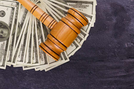 The auctioneers hammer on dollar bills.の写真素材