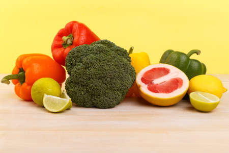 Proper nutrition, fruits and vegetables. Lemon, grapefruit, lime, broccoli and pepper.の写真素材