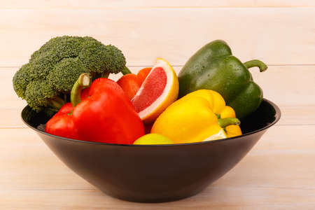 In a plate are useful vegetables and citrus fruits.の写真素材