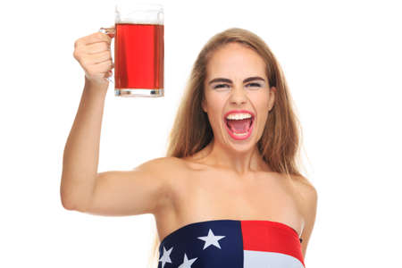 Young woman, blonde, holds a glass of beer, isolated on white backgroundの写真素材