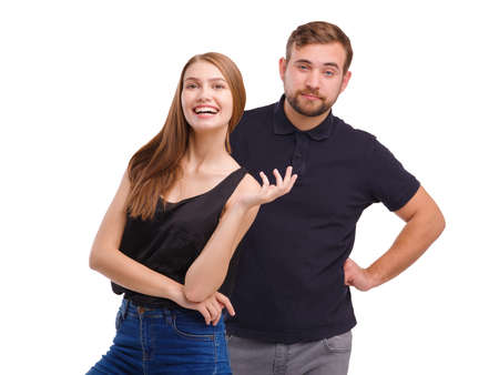 Portrait of young couple standing side by side, isolated on white background.の写真素材