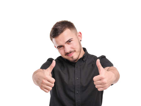 A guy shows two thumbs up on a white isolated background. Front viewの写真素材